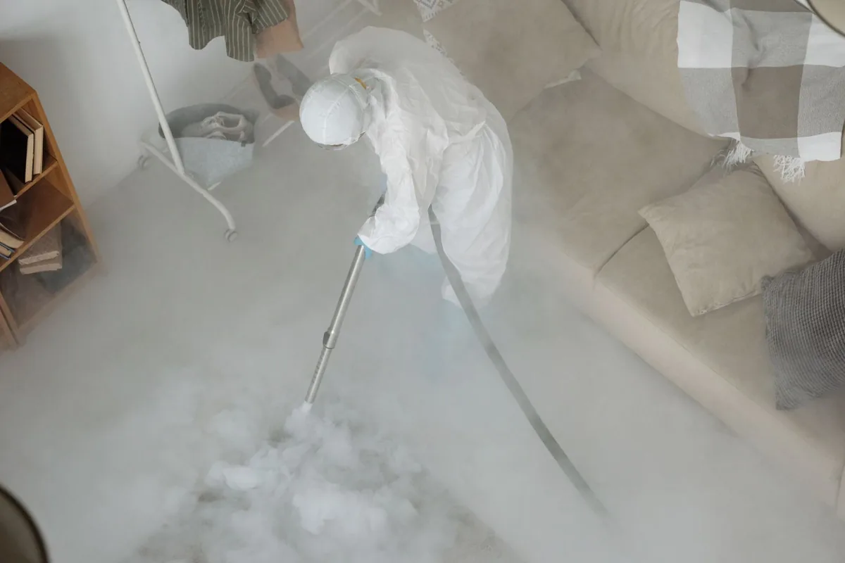 Biohazard cleanup technician in protective equipment, Germantown, WI